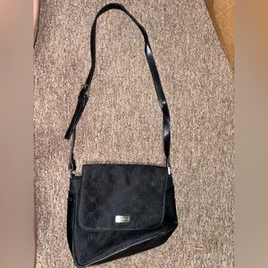 Rossetti crossbody bag with snap closure front and back wallet pocket.